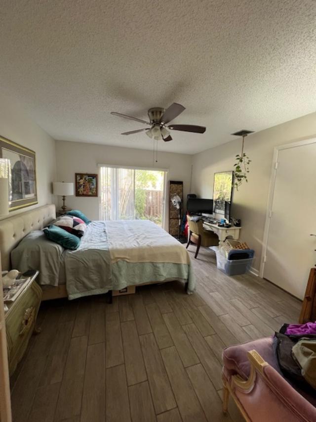 11750 Timbers Way Boca Raton, FL 33428 - Photo 8 of 25 a bedroom with a bed couch and a window