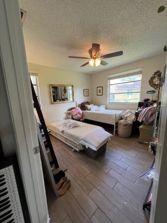 11750 Timbers Way Boca Raton, FL 33428 - Photo 10 of 25 a bedroom with a bed couch and window