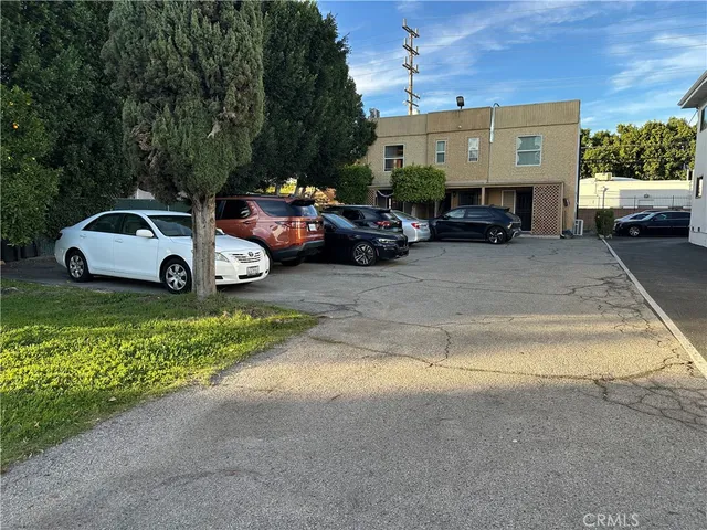 a view of street with parked cars