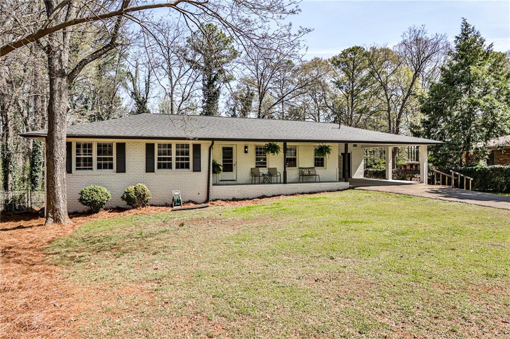 1598 Kings Road Marietta, GA 30062 - Photo 1 of 1 front view of a house with a swimming pool