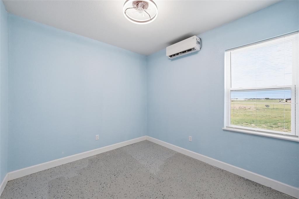 151 Kasberg Road Leroy, TX 76691 - Photo 18 of 40 an empty room with a window
