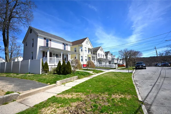 a view of a building with a yard