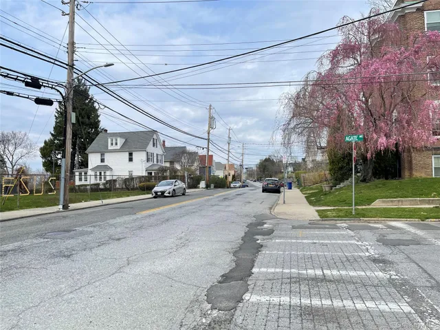 a view of a park with parked cars