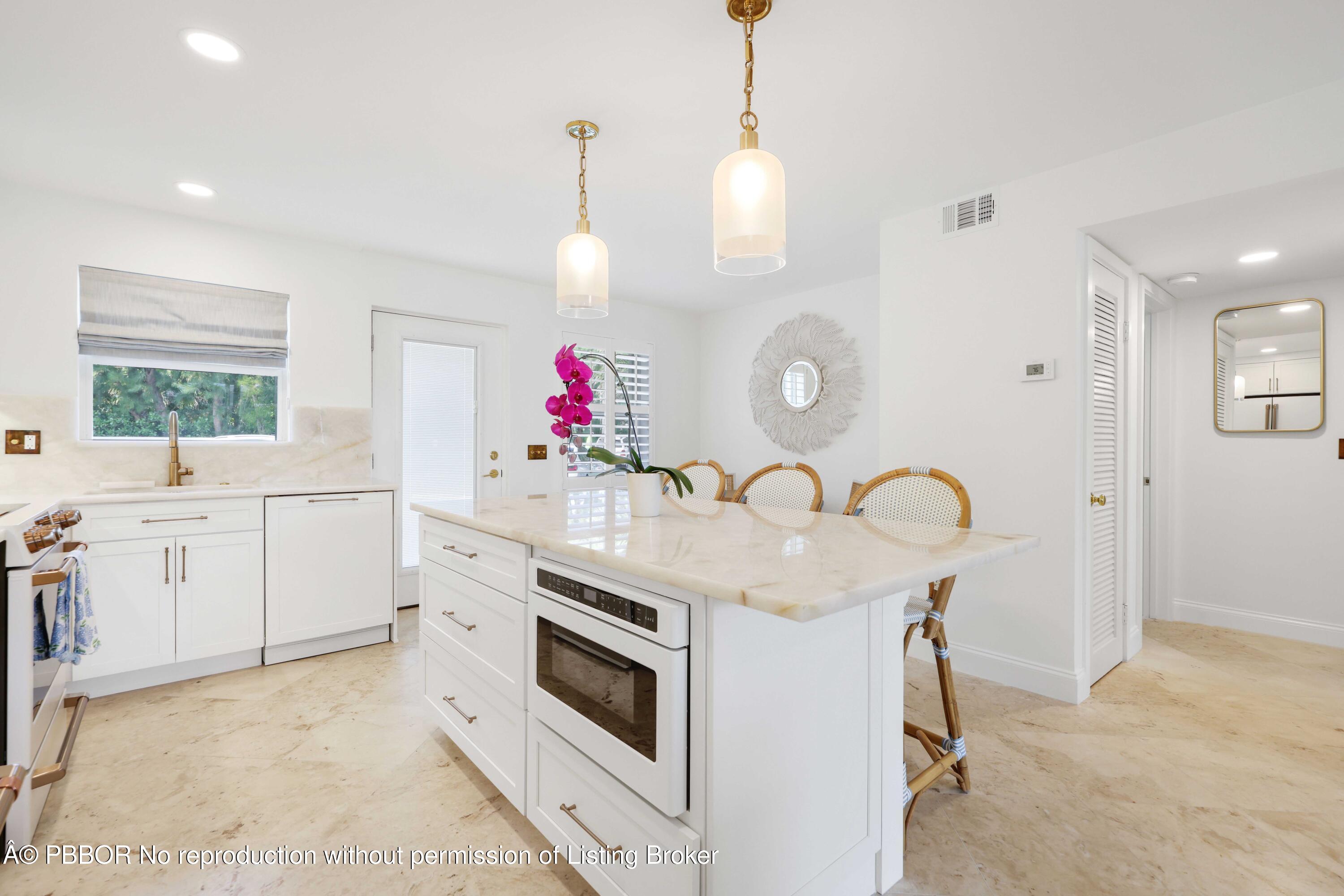 Undisclosed Address Palm Beach, FL 33480 - Photo 13 of 43 a kitchen that has cabinets a sink and a stove