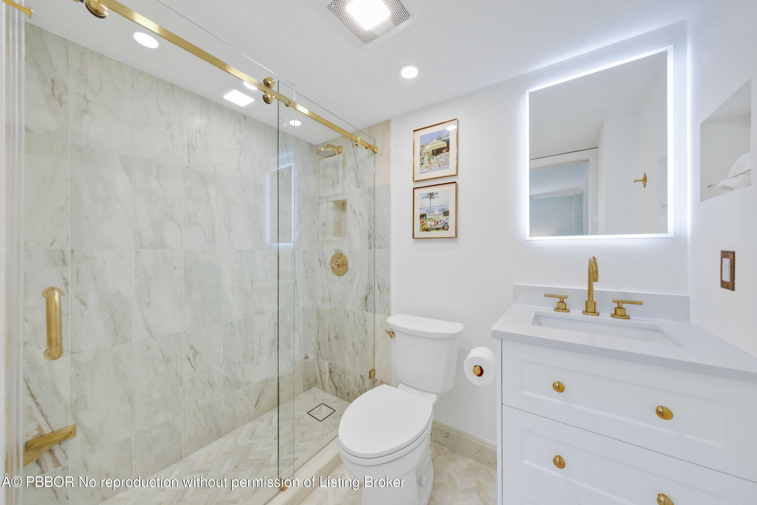 Undisclosed Address Palm Beach, FL 33480 - Photo 18 of 43 a bathroom with a granite countertop sink a toilet and a shower