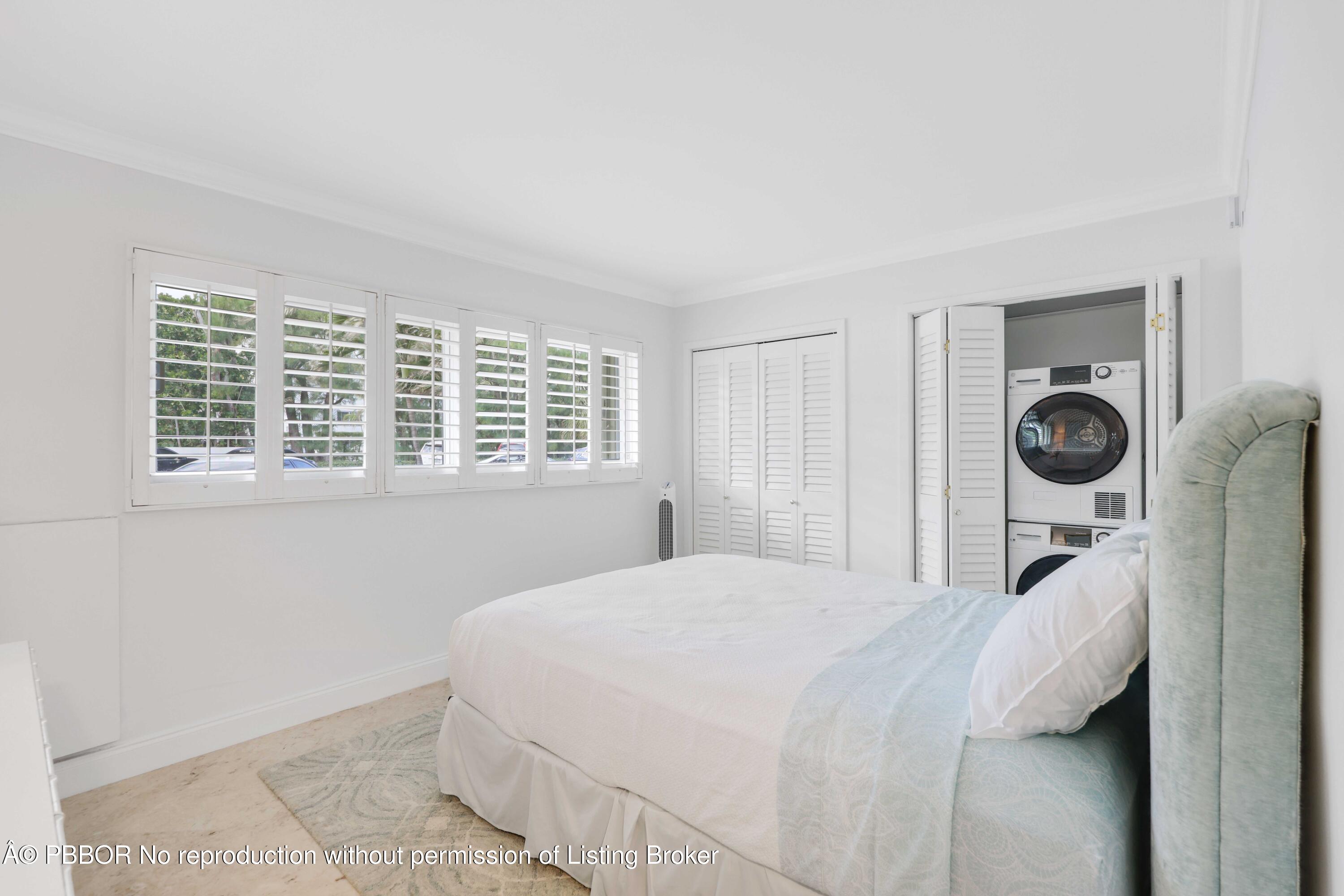 Undisclosed Address Palm Beach, FL 33480 - Photo 19 of 43 a bedroom with a bed and a window