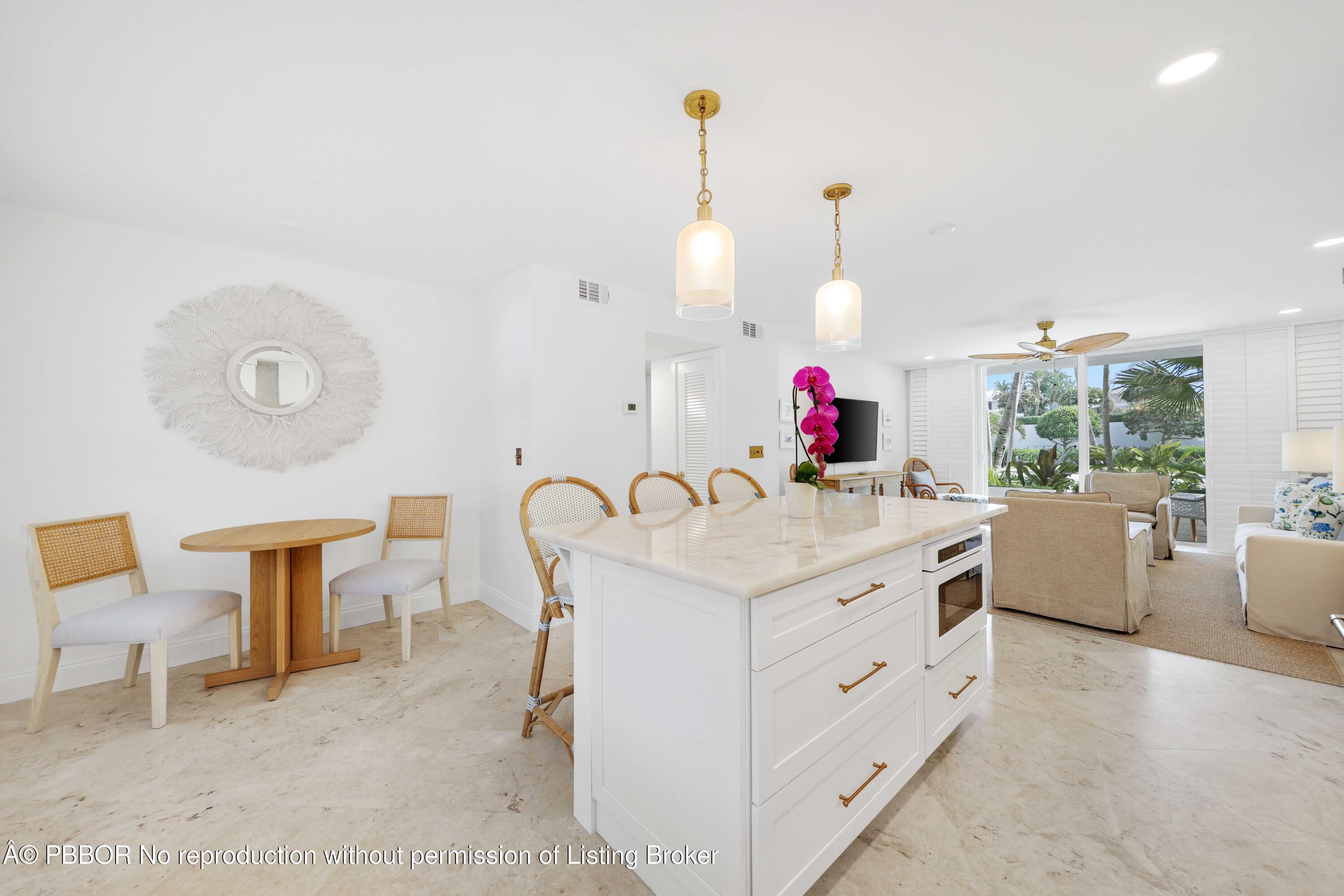 Undisclosed Address Palm Beach, FL 33480 - Photo 10 of 43 a kitchen with a stove and a table