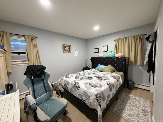 a bedroom with bed and a window