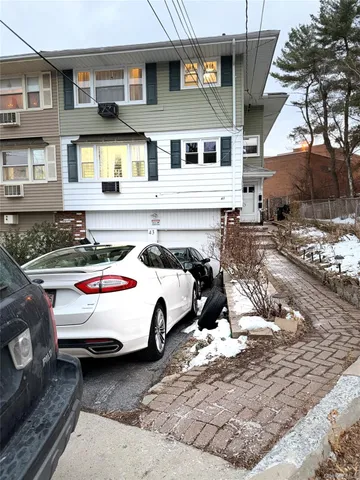 a car parked in front of a house