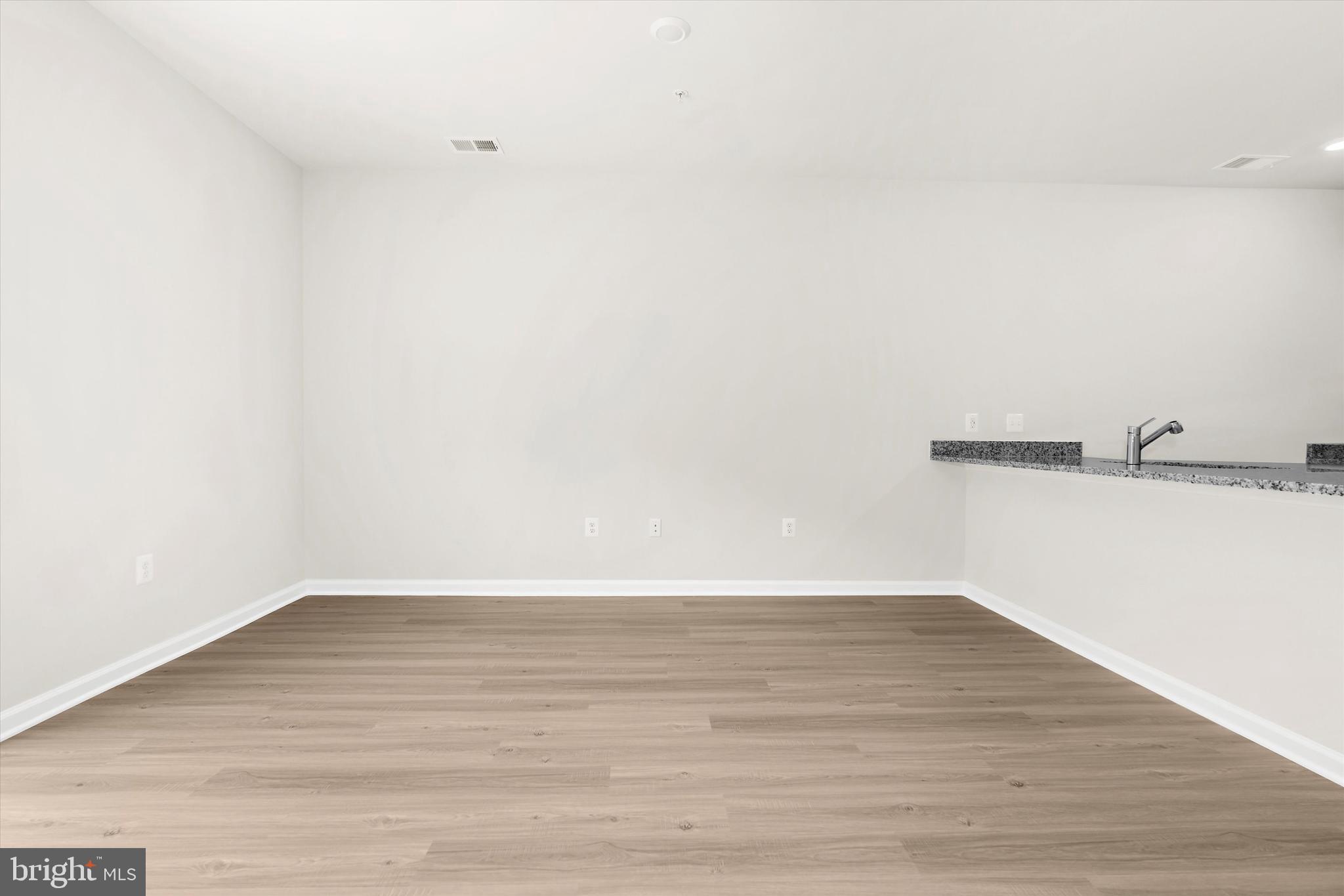 8131 Bartholomew Court Baltimore, MD 21206 - Photo 11 of 47 a view of a room with wooden floor