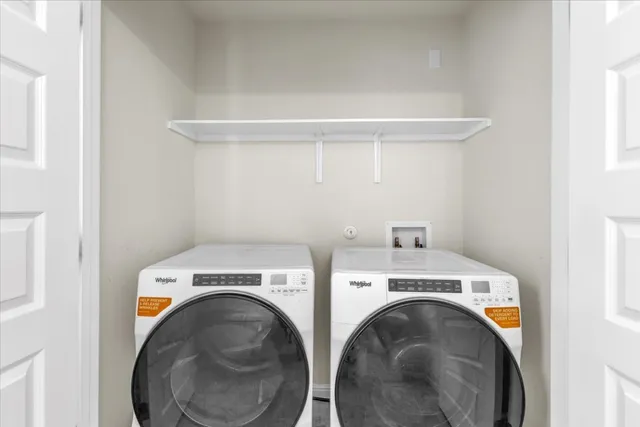 a view of a kitchen with a sink and a window