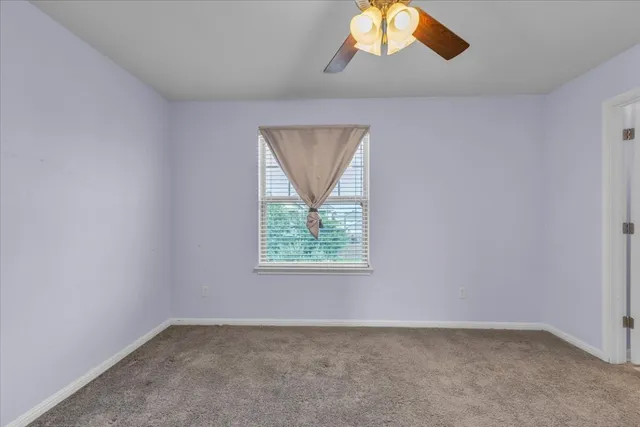 a bathroom with a bathtub shower sink vanity and toilet