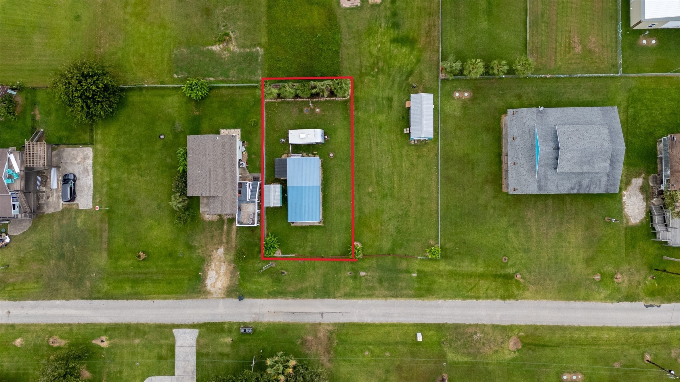 1061 E Road Port Bolivar, TX 77650 - Photo 3 of 28 an aerial view of residential house with outdoor space