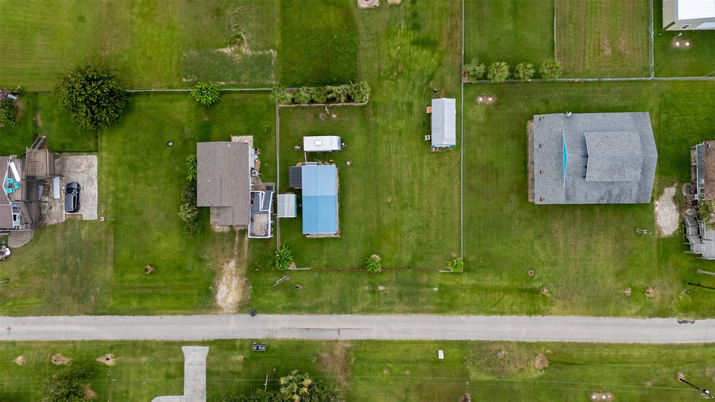 1061 E Road Port Bolivar, TX 77650 - Photo 4 of 28 an aerial view of residential houses with outdoor space and swimming pool