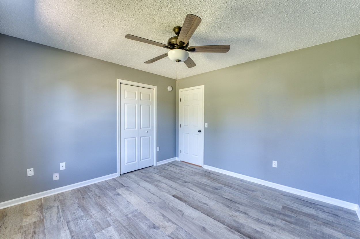 1464 Little Dry Creek Road Pulaski, TN 38478 - Photo 12 of 26 wooden floor in an empty room with a window