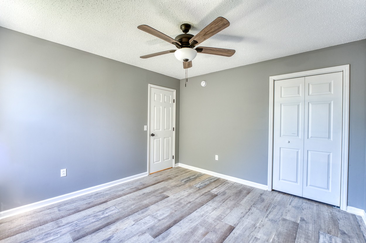 1464 Little Dry Creek Road Pulaski, TN 38478 - Photo 16 of 26 wooden floor in an empty room with a window