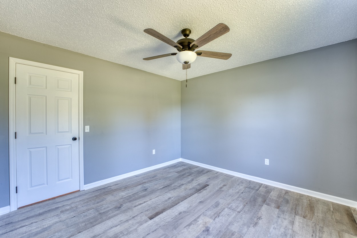 1464 Little Dry Creek Road Pulaski, TN 38478 - Photo 21 of 26 a view of an empty room with wooden floor
