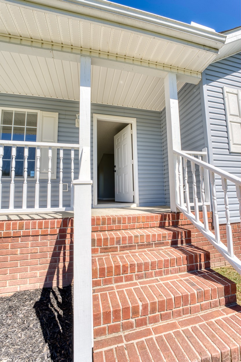 1464 Little Dry Creek Road Pulaski, TN 38478 - Photo 3 of 26 a view of front door of house with large windows