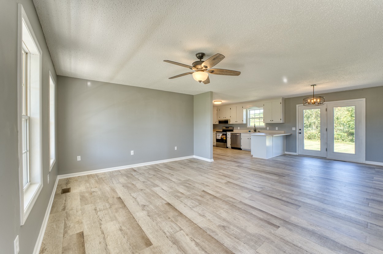 1464 Little Dry Creek Road Pulaski, TN 38478 - Photo 5 of 26 wooden floor in an empty room with a window