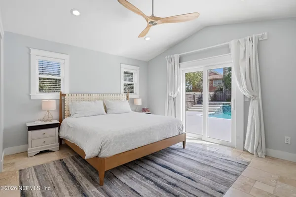 a bedroom with a bed and window