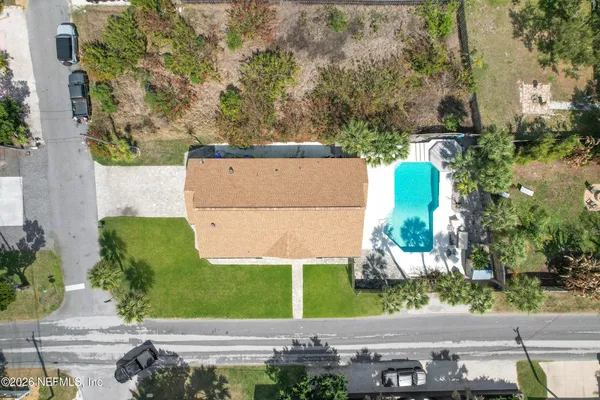 an aerial view of a house with outdoor space