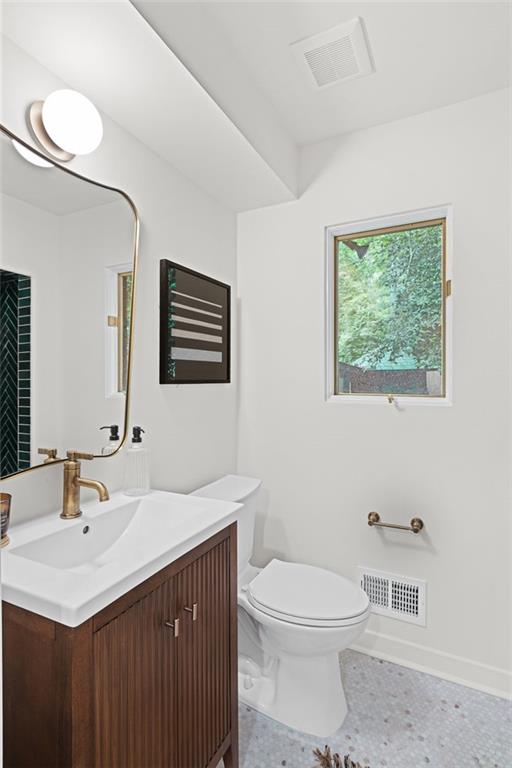 922 Barton Woods Road Northeast Atlanta, GA 30307 - Photo 49 of 96 a bathroom with a sink a toilet and mirror