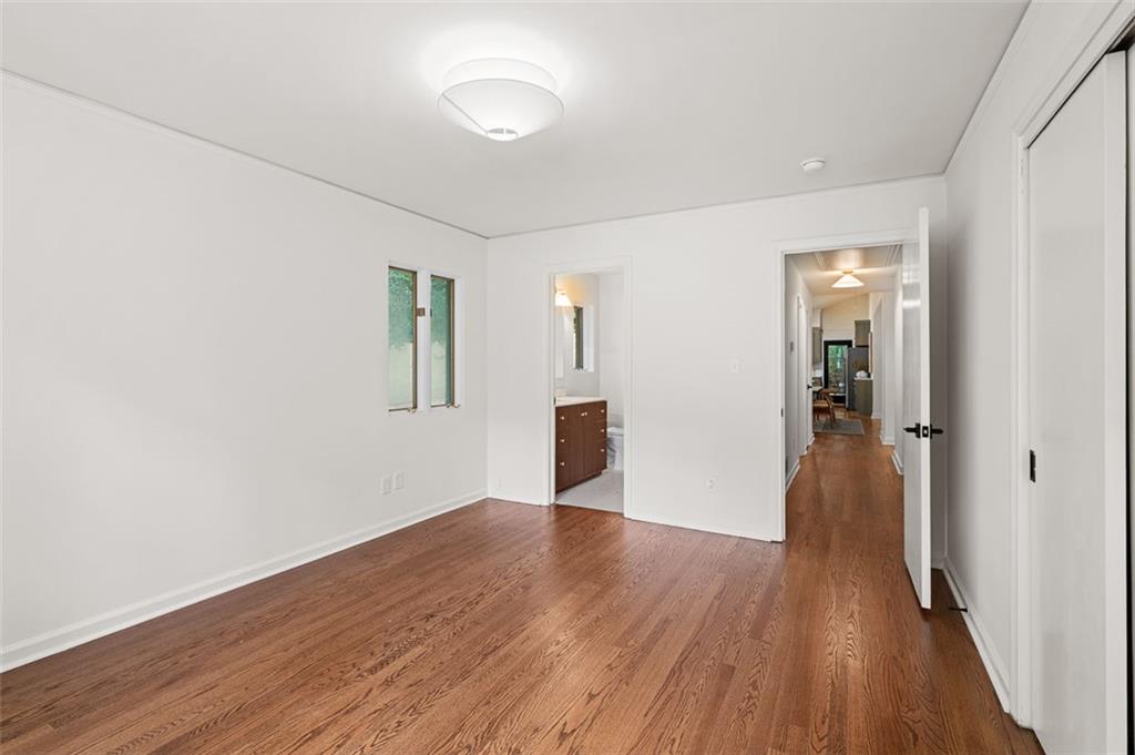 922 Barton Woods Road Northeast Atlanta, GA 30307 - Photo 54 of 96 a view of a hallway with wooden floor and closet