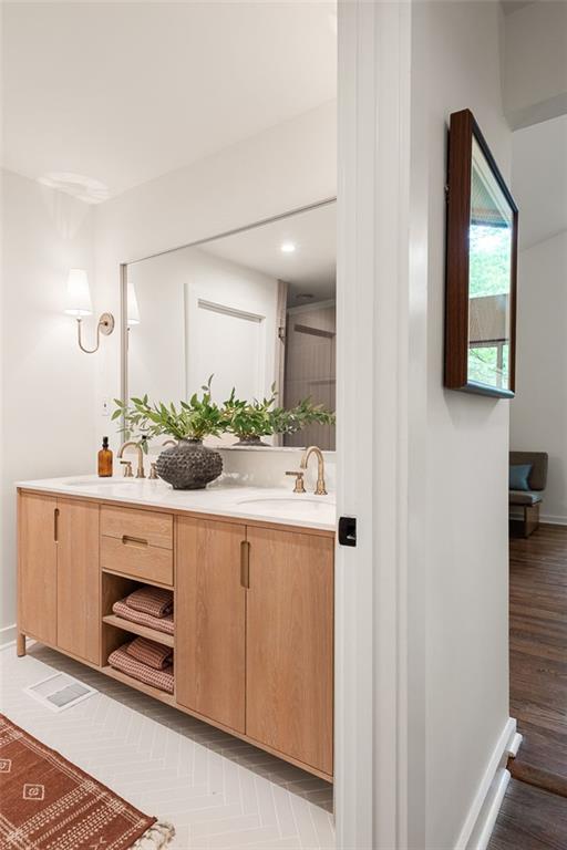 922 Barton Woods Road Northeast Atlanta, GA 30307 - Photo 63 of 96 a spacious bathroom with a double vanity sink and mirror