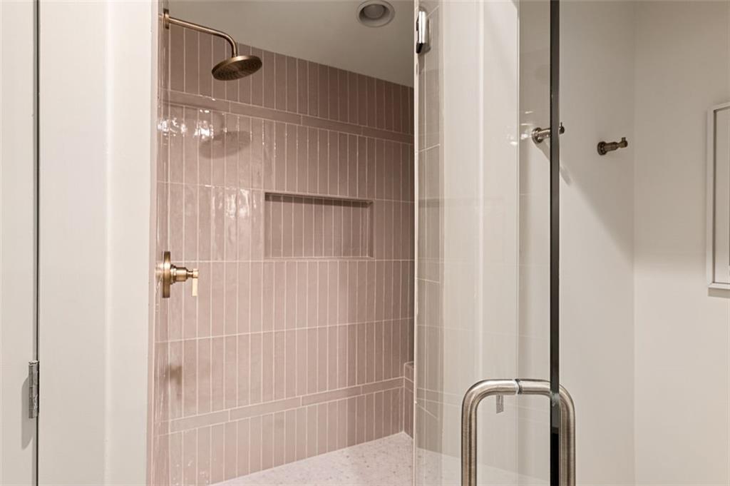 922 Barton Woods Road Northeast Atlanta, GA 30307 - Photo 65 of 96 a bathroom with a glass shower door
