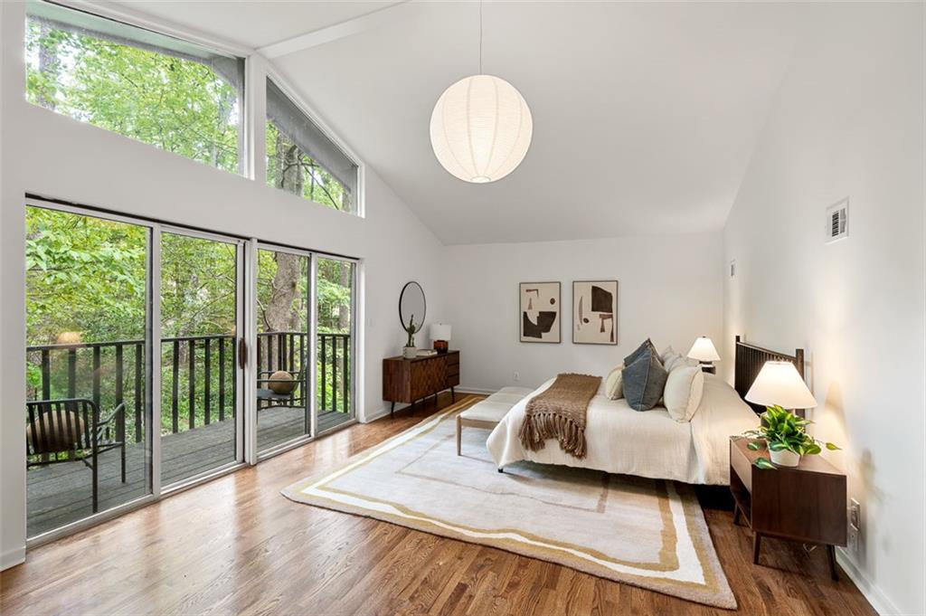922 Barton Woods Road Northeast Atlanta, GA 30307 - Photo 67 of 96 a bedroom with a bed and a large window