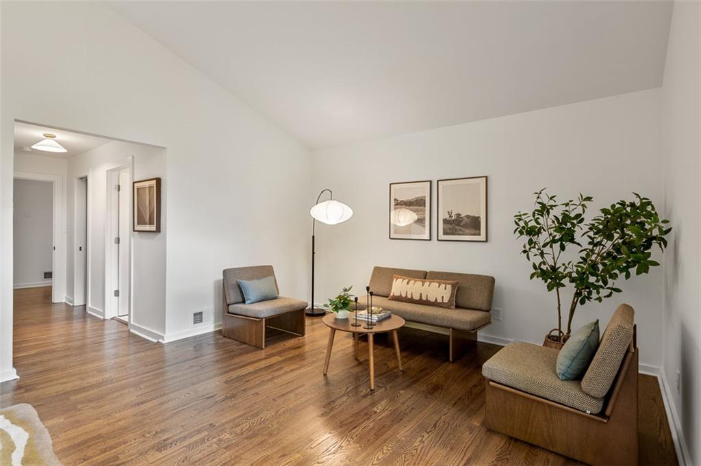 922 Barton Woods Road Northeast Atlanta, GA 30307 - Photo 69 of 96 a living room with furniture and a potted plant