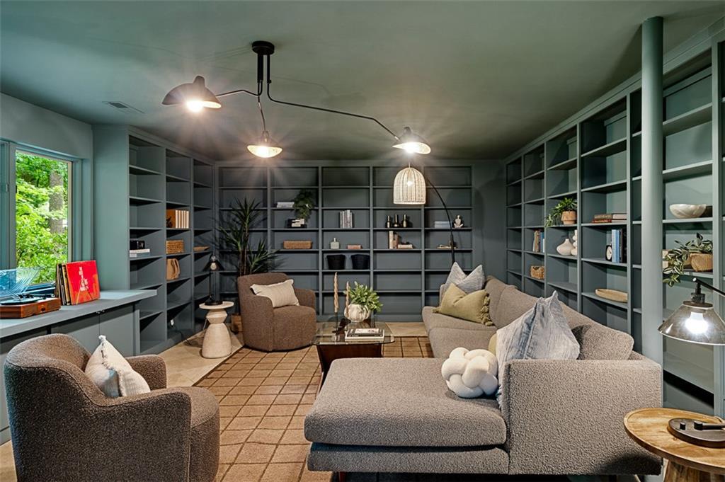 922 Barton Woods Road Northeast Atlanta, GA 30307 - Photo 79 of 96 a living room with furniture and a book shelf