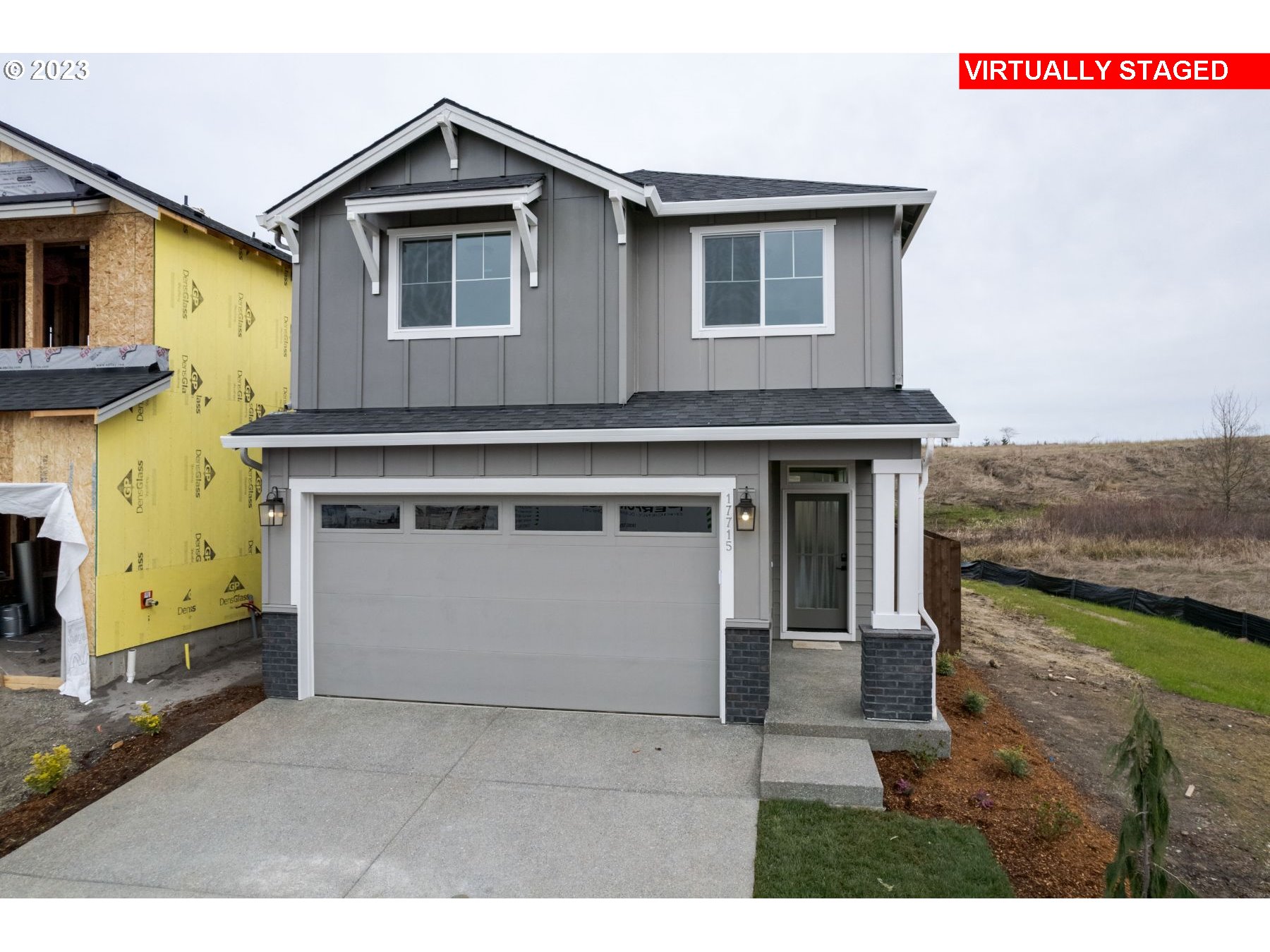 7th Avenue Ridgefield, WA 98642 - Photo 1 of 3 a front view of a house with a yard and garage