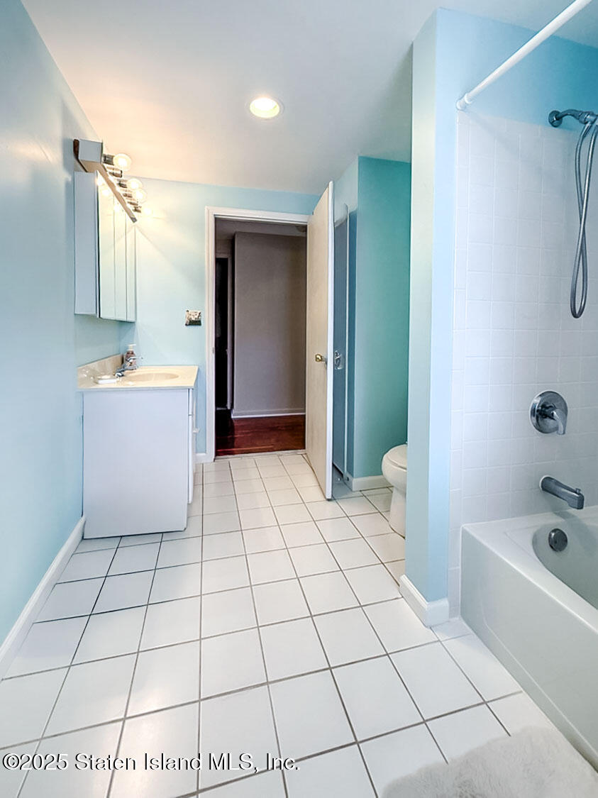 7 Cherry Bend Drive Howell, NJ 07731 - Photo 19 of 27 a bathroom with a bathtub and a shower