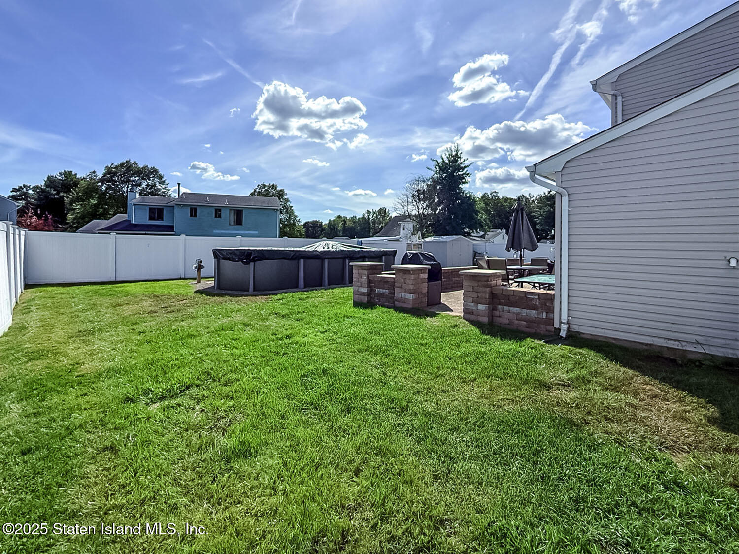 7 Cherry Bend Drive Howell, NJ 07731 - Photo 23 of 27 a view of a house with backyard and a garden