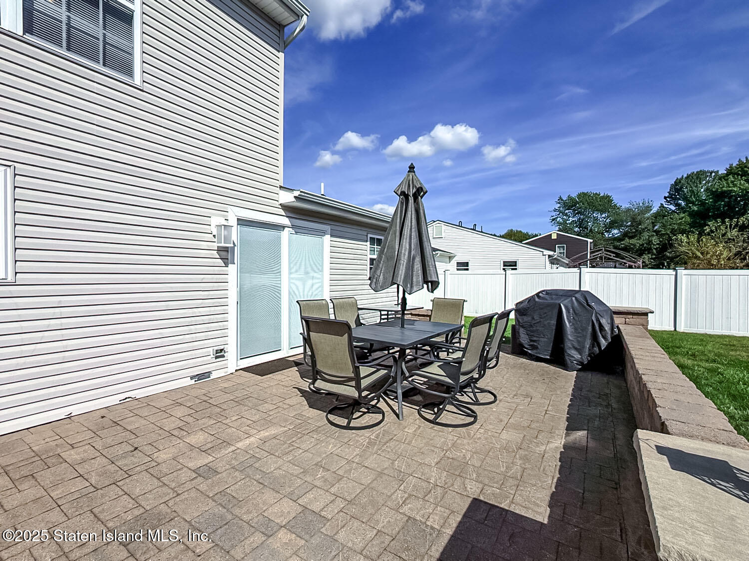 7 Cherry Bend Drive Howell, NJ 07731 - Photo 27 of 27 a view of a patio with table and chairs and wooden floor