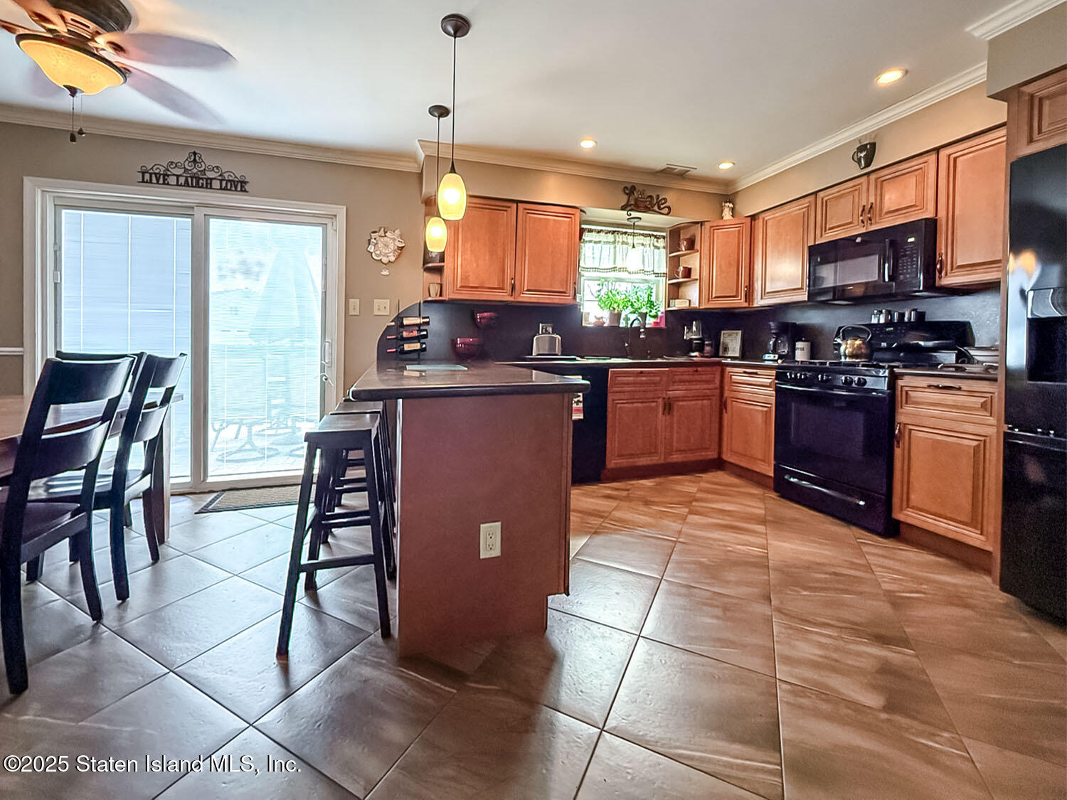 7 Cherry Bend Drive Howell, NJ 07731 - Photo 6 of 27 a kitchen with stainless steel appliances granite countertop a table and chairs in it