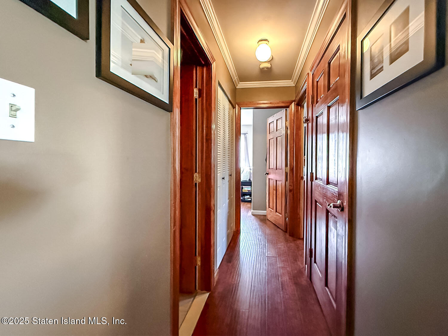 7 Cherry Bend Drive Howell, NJ 07731 - Photo 10 of 27 a view of a hallway with wooden floor and staircase