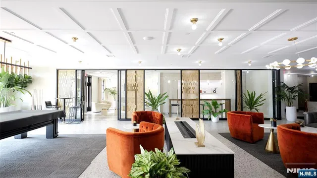 a living room with furniture a large window with outer view