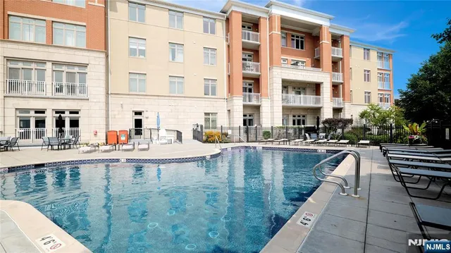 a view of a swimming pool with a outdoor seating