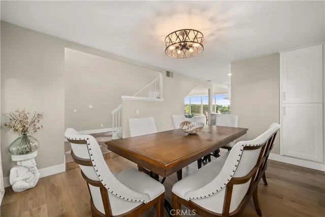 a view of a dining table and chairs in the room