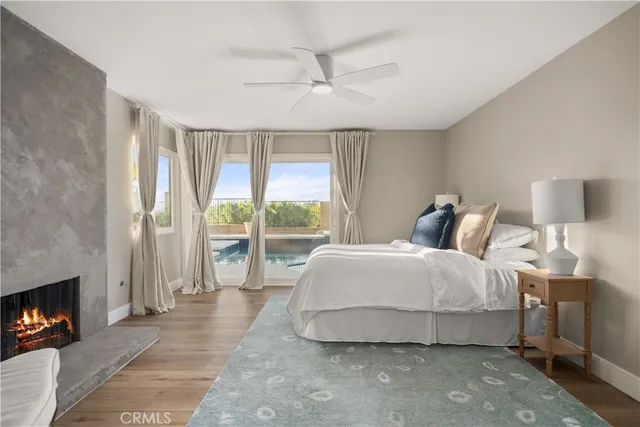 a bedroom with bed and a fireplace