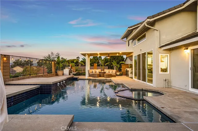 a view of a patio with swimming pool table and chairs