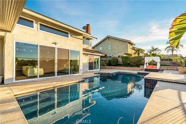 a view of a swimming pool with a lounge chairs