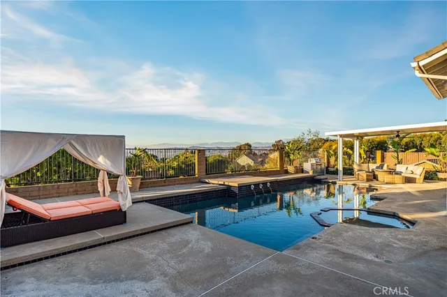a view of swimming pool with seating area