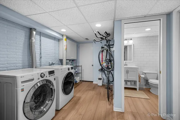 a view of a storage & utility room with washer and dryer