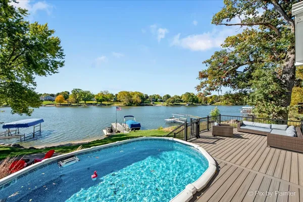 a view of a lake with outdoor seating