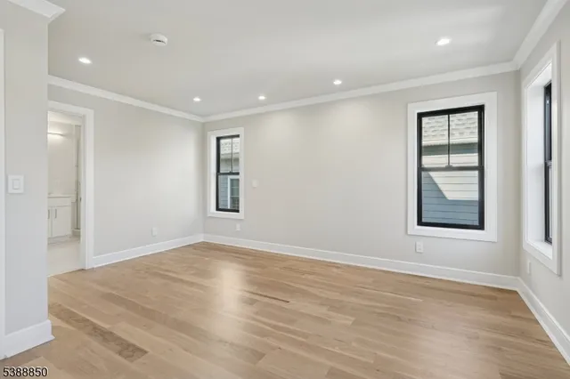 a spacious bathroom with a shower sink vanity mirror and toilet