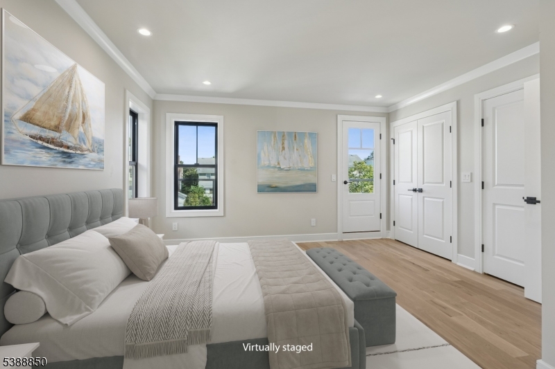 27 Willow Street, Unit A Millburn, NJ 07041 - Photo 27 of 50 a bedroom with a large bed and a window