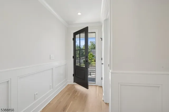 a kitchen with a table chairs sink and cabinets